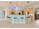 Bright kitchen with breakfast bar, pendant lighting, stainless steel appliances, and adjacent dining area at 1426 Lakemist Ln, Clermont, FL 34711