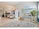 Inviting living room showcasing stylish decor, ample natural light, and an open layout with access to other living spaces at 1426 Lakemist Ln, Clermont, FL 34711