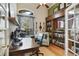 Spacious office with a large desk, shelving, and a window that brings in natural light at 1426 Lakemist Ln, Clermont, FL 34711