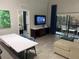 Open floor plan living room that opens up to the screened patio at 14501 Grove Resort Ave # 3406, Winter Garden, FL 34787