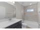 Modern bathroom with a tiled shower, a bathtub and a vanity with a mirror at 14611 Se 95Th Ct, Summerfield, FL 34491