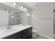 Bathroom with a double vanity sink and a large walk-in shower at 14611 Se 95Th Ct, Summerfield, FL 34491