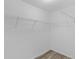 An empty walk-in closet with wire shelving at 14611 Se 95Th Ct, Summerfield, FL 34491
