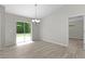 Bright dining area with sliding glass doors leading to the backyard at 14611 Se 95Th Ct, Summerfield, FL 34491