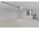 Spacious two car garage with block wall, bright lighting, and utilities at 14611 Se 95Th Ct, Summerfield, FL 34491