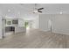 Spacious open-concept living space with great natural light and a view of the kitchen at 14611 Se 95Th Ct, Summerfield, FL 34491