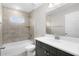 Bright bathroom with shower/tub combo, modern vanity, and updated fixtures at 14631 Se 95Th Ct, Summerfield, FL 34491