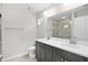 Bathroom with double-sink vanity, quartz countertop, and tiled walk-in shower at 14631 Se 95Th Ct, Summerfield, FL 34491