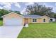 Beautiful single-Gathering home with well-maintained landscaping, a two-car garage, and excellent curb appeal at 14631 Se 95Th Ct, Summerfield, FL 34491