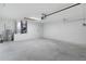 Spacious two car garage features a water heater, HVAC system, and lots of room for parking at 14631 Se 95Th Ct, Summerfield, FL 34491
