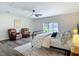 Bright bedroom with hardwood floors, ceiling fan, and a window with a neighborhood view at 1611 Canal, Tavares, FL 32778