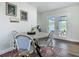Charming dining area with french doors leading to the screened pool and lanai at 1611 Canal, Tavares, FL 32778
