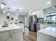 Well-appointed kitchen featuring stainless appliances, an island, and a seamless transition to the outdoors at 1611 Canal, Tavares, FL 32778
