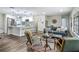 Open concept living room, seamlessly connecting to the kitchen with an island and breakfast bar at 1611 Canal, Tavares, FL 32778