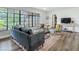 Comfortable living room featuring modern decor, a large window, and seamless transition to other spaces at 1611 Canal, Tavares, FL 32778
