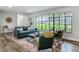 Inviting living room featuring a large window, comfortable seating, and stylish decor at 1611 Canal, Tavares, FL 32778