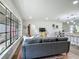Spacious living area, featuring an open floor plan with kitchen access and large bright windows at 1611 Canal, Tavares, FL 32778