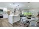 Open-concept kitchen and dining area with seamless flow into the living room at 1611 Canal, Tavares, FL 32778