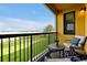 Serene balcony with seating and scenic water views, perfect for relaxing and enjoying the outdoors at 16300 County Road 455 # 202, Montverde, FL 34756