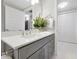 Modern bathroom with gray vanity, spacious countertop, and stylish fixtures, offering a sleek and serene retreat at 16300 County Road 455 # 202, Montverde, FL 34756