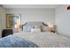 Well-appointed bedroom featuring a large bed, soft lighting, and decorative artwork at 16300 County Road 455 # 202, Montverde, FL 34756