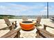 Lakeside fire pit with Adirondack chairs at 16300 County Road 455 # 202, Montverde, FL 34756