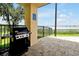 Community outdoor grilling area with a grill overlooking the lake at 16300 County Road 455 # 202, Montverde, FL 34756