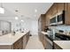 Lovely modern kitchen with stainless appliances, beautiful countertops, and a convenient breakfast bar at 16300 County Road 455 # 202, Montverde, FL 34756