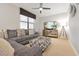 Cozy living room with a comfortable sectional sofa and entertainment center at 16300 County Road 455 # 202, Montverde, FL 34756