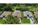 Aerial view showcasing the property's layout, screened-in pool, landscaping, and proximity to the golf course at 16862 Se 80Th Bellavista Cir, The Villages, FL 32162