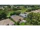 Aerial view of a property near the golf course in a residential neighborhood with tree-lined streets at 16862 Se 80Th Bellavista Cir, The Villages, FL 32162