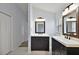 Bathroom featuring double vanity, white countertops and dark wood cabinets at 16862 Se 80Th Bellavista Cir, The Villages, FL 32162