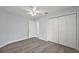 Neutral room with updated wood-look flooring, large closet and a ceiling fan at 16862 Se 80Th Bellavista Cir, The Villages, FL 32162
