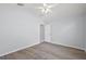 Light-filled bedroom featuring wood-look flooring, ceiling fan, and neutral walls at 16862 Se 80Th Bellavista Cir, The Villages, FL 32162