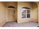 Inviting front porch with brick flooring, a front door, and an arched window at 16862 Se 80Th Bellavista Cir, The Villages, FL 32162