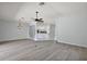 Open concept living area with view to kitchen and entry at 16862 Se 80Th Bellavista Cir, The Villages, FL 32162
