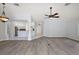 Open concept living and dining area with view to kitchen and front door at 16862 Se 80Th Bellavista Cir, The Villages, FL 32162