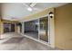 Covered patio with tile flooring and ceiling fans offering seamless indoor/outdoor living through sliding glass doors at 16862 Se 80Th Bellavista Cir, The Villages, FL 32162