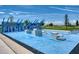 Outdoor fitness court featuring multiple exercise stations, providing a convenient workout area for the community at 1696 Wilson Prairie Cir, Groveland, FL 34736