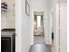 Hallway view including laundry room, bedroom entrance and other room at 1696 Wilson Prairie Cir, Groveland, FL 34736