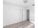 Bright bedroom with carpet, a closet with sliding doors, and neutral paint at 1726 Tropical Ct, Tavares, FL 32778