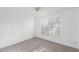 Well-lit bedroom with carpet, window with blinds, and neutral paint at 1726 Tropical Ct, Tavares, FL 32778