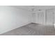 Bedroom featuring neutral carpeting, closet with doors, and bright natural light at 1726 Tropical Ct, Tavares, FL 32778