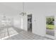 Inviting living room features tile floors and easy access to kitchen and outdoor patio at 1726 Tropical Ct, Tavares, FL 32778