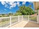 The home has a balcony offering a view of the surrounding neighborhood and well-kept landscaping at 17300 Summer Sun Ct, Clermont, FL 34711