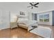 Light-filled main bedroom featuring neutral decor and a comfortable queen-sized bed at 17300 Summer Sun Ct, Clermont, FL 34711