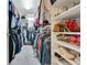 This closet is completely full with clothes and shoes neatly stacked at 17300 Summer Sun Ct, Clermont, FL 34711