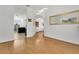Hallway leading to an open floor plan concept of the kitchen and living room at 17300 Summer Sun Ct, Clermont, FL 34711