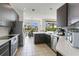 Well-equipped kitchen with stainless steel appliances and adjacent dining area at 17300 Summer Sun Ct, Clermont, FL 34711