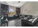 Inviting living room featuring hardwood floors, built-in bookshelves, and comfortable seating at 17300 Summer Sun Ct, Clermont, FL 34711